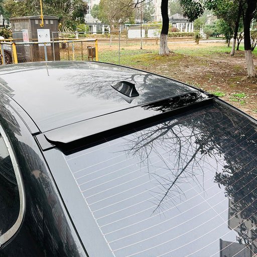 Black roof spoiler tagspoiler for BMW F10 installed on white vehicle