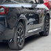 Black BMW X3 G01 side skirts with polished chrome rocker panel trim detail