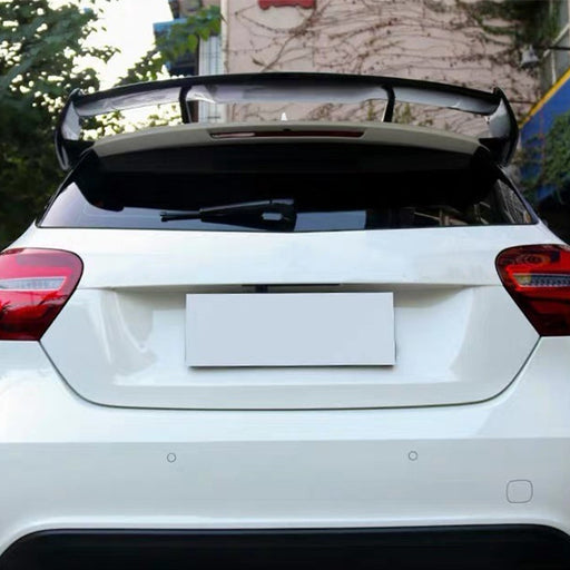 Black roof wing spoiler installed on white Mercedes-Benz A-Class W176 hatchback rear view