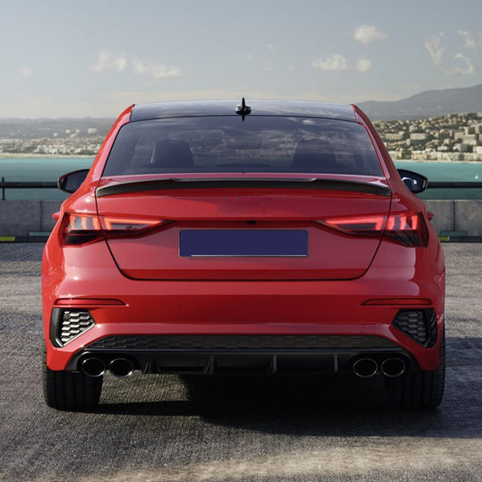 Black glossy rear spoiler for Audi A3 8Y Sedan Dynamic installed on red car trunk lid