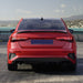 Black glossy rear spoiler for Audi A3 8Y Sedan Dynamic installed on red car trunk lid