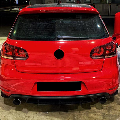 Black blade diffuser rear bumper on Volkswagen Golf 6 GTI red car, aerodynamic tuning accessory