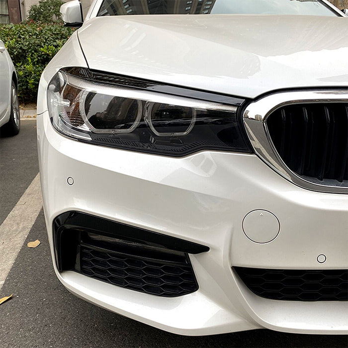 Black eyebrow headlight covers BMW G30 2018-2020 installed on white car