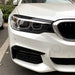 Black eyebrow headlight covers BMW G30 2018-2020 installed on white car