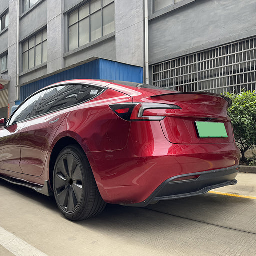 Black bagspoiler trunk spoiler for Tesla Model 3 2023+ installed on red car rear view