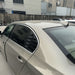 Black trunk shade cargo cover for BMW 5-Serie E60 installed on white sedan
